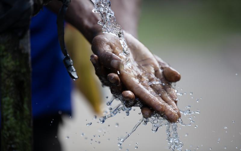 Washing hands under running water