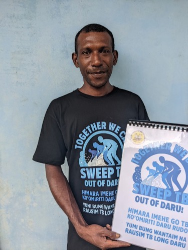 Image: TB survivor and founding TB Nanito Kopia Kodu member Saguba Wainetti pictured with the one of the newly developed education flipcharts developed in consultation with the group.