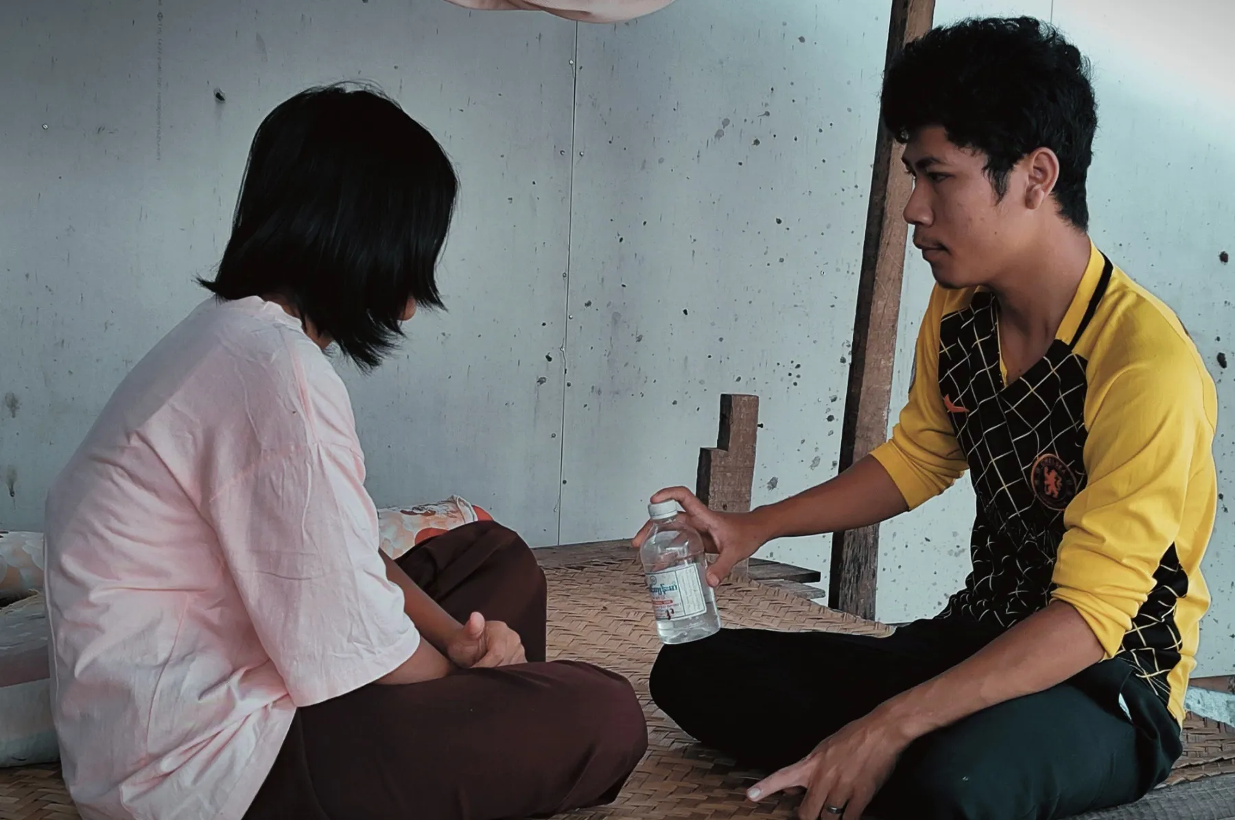 Aung Aung has a conversation with a friend.