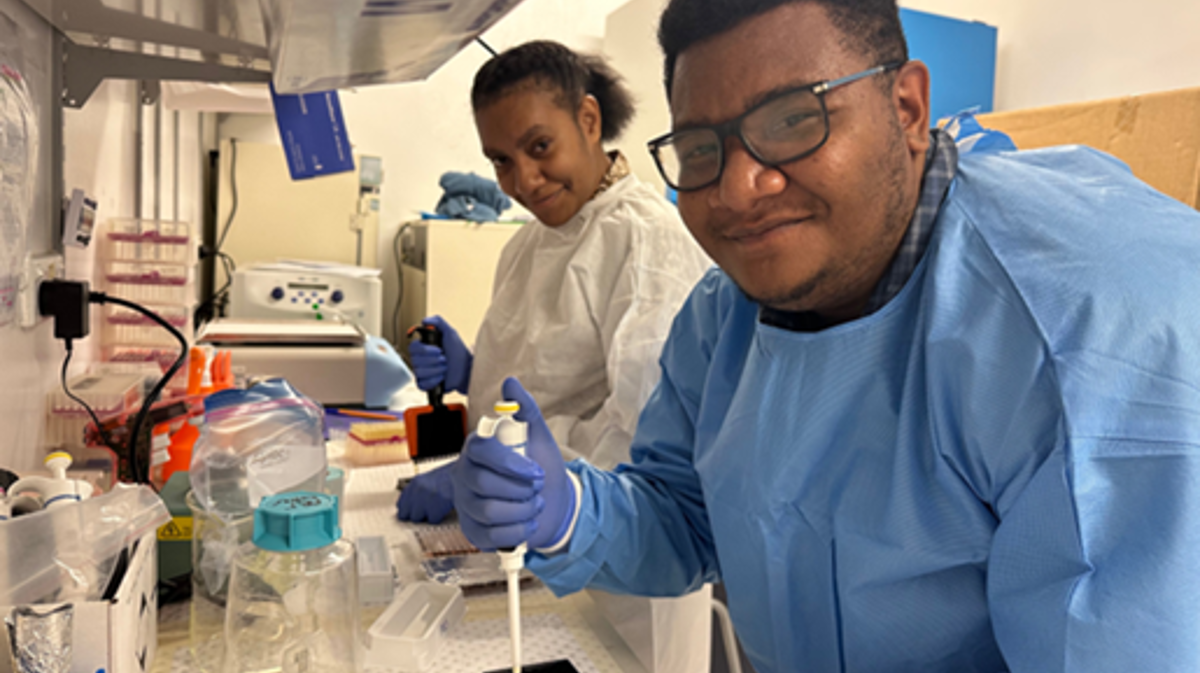 Scientists working at a laboratory bench.
