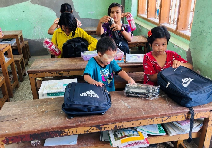 Monastic Education Students With Their Schooling Packs