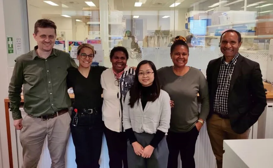 Pictured left to right: Lachlan Coin, Sharon Trevor, Jennifer Kopania Banamu, An Nguyen, Nomin-Dora Tenakanai and Rendi Moke at the Peter Doherty Institute for Infection and Immunity.