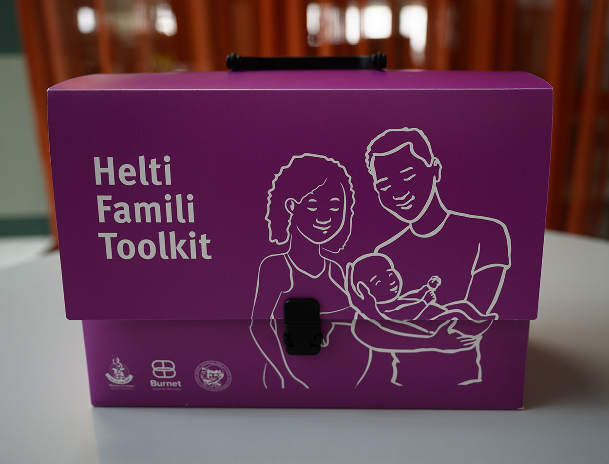 The Triple Elimination Toolkit box. It has the words 'Helti famili toolkit' written on it.
