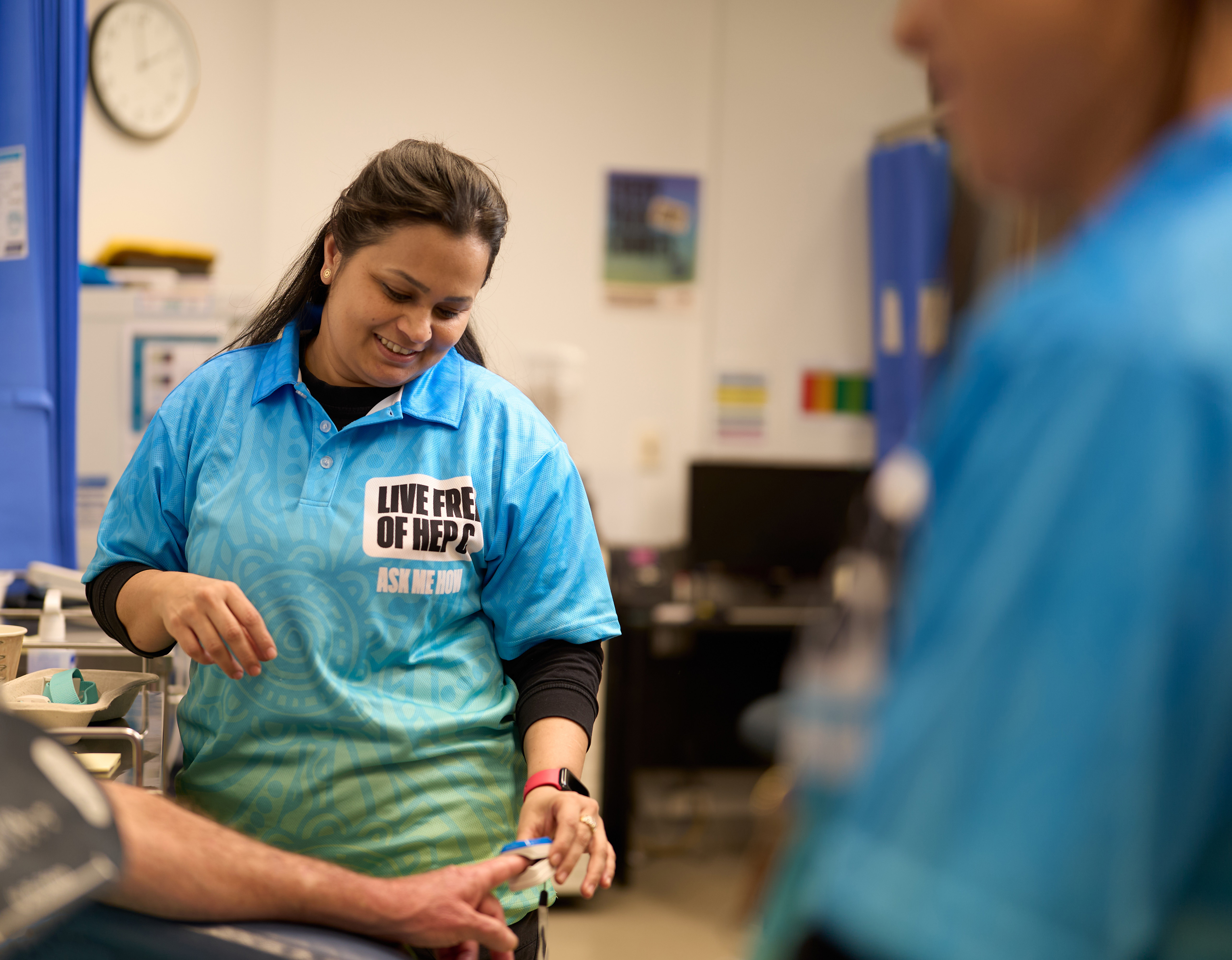 Smiling health worker at Victorian Aboriginal Health Service.