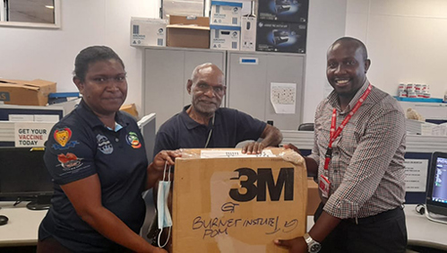 Image: Fleming Fund Country Grant Coordinator Kaba Ula, Deputy Director Medical Services ANGAU Memorial Hospital Dr Russo Perone and Microbiology Officer Dr Victor Musyoki with goods for ANGAU Lab in Lae, PNG.