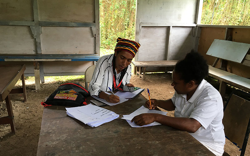 Burnet staff working in PNG by gathering data.