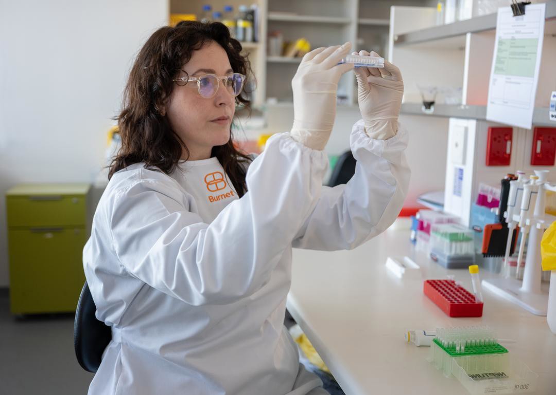 Researcher Fiona Angrisano working in a lab.